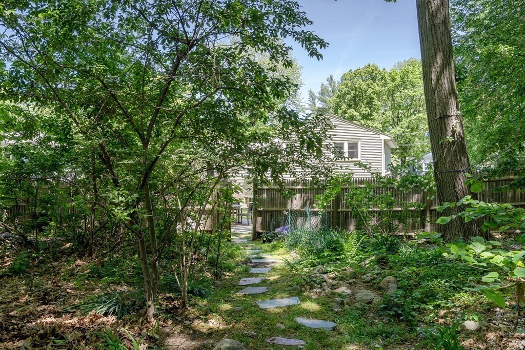 122 Chickering Road Dedham, MA 02026 - Photo 40 of 41 a view of a house with a yard