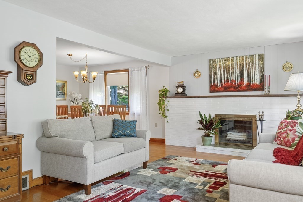 122 Chickering Road Dedham, MA 02026 - Photo 7 of 41 a living room with furniture and a fireplace