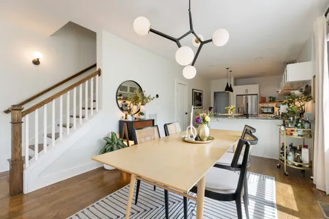 a view of dining table and chairs