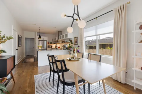 a kitchen with stainless steel appliances a sink a stove and refrigerator
