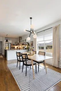 a kitchen with a sink a stove and cabinets