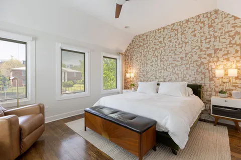 a bathroom with a granite countertop sink mirror and a