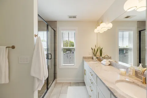 a bathroom with a sink mirror vanity and toilet