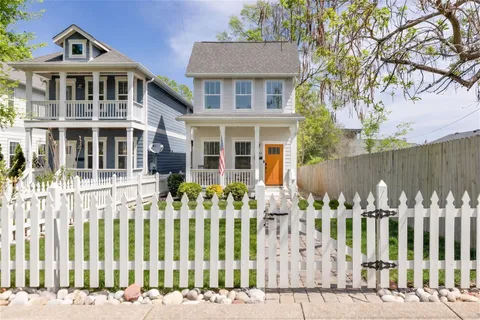 front view of a house with a garden