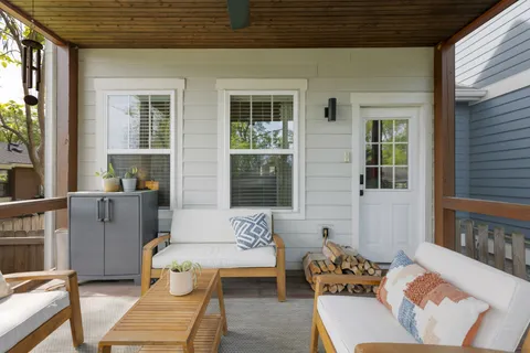 a view of a house with small yard and plants