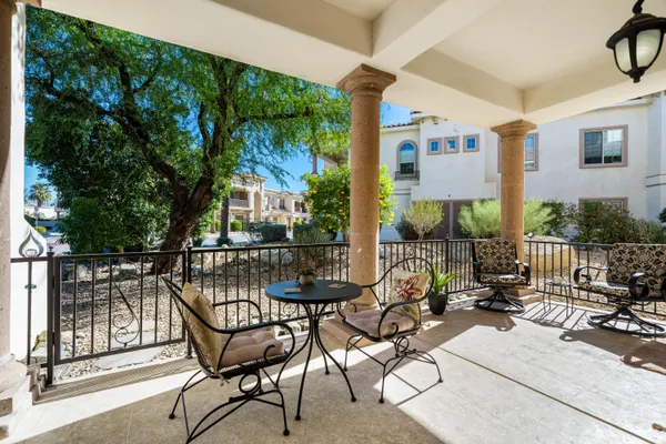 a view of a chairs and tables in patio