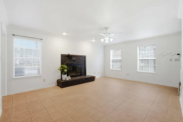 a kitchen with stainless steel appliances granite countertop a refrigerator a stove a sink and a microwave