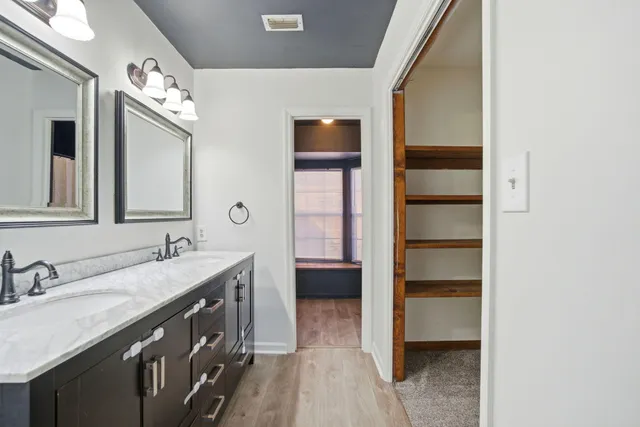 a bathroom with a bathtub and a window