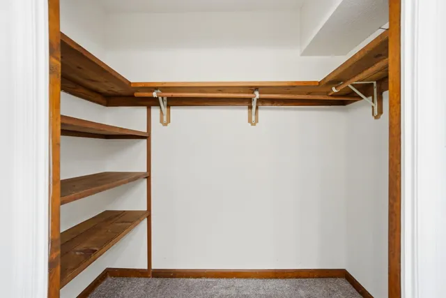 a bathroom with a toilet and a shower curtain