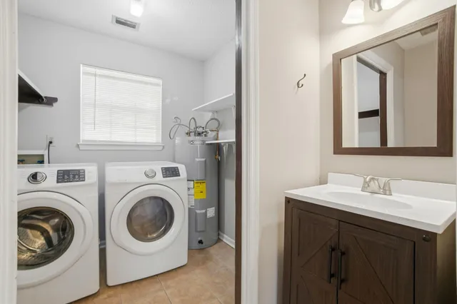 a utility room with dryer and washer