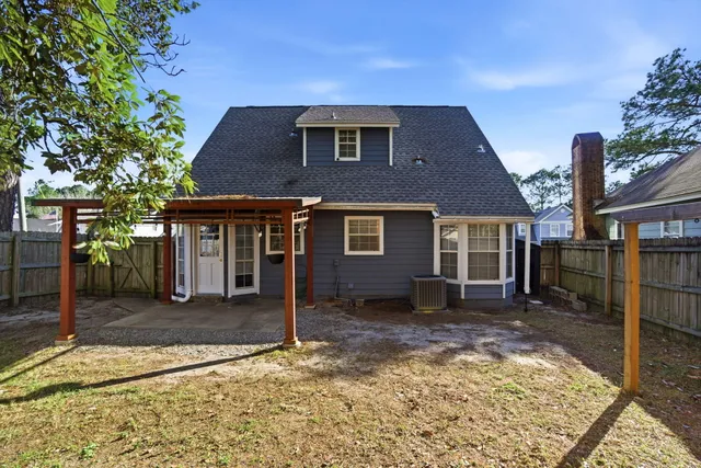 a view of swimming pool with an outdoor seating