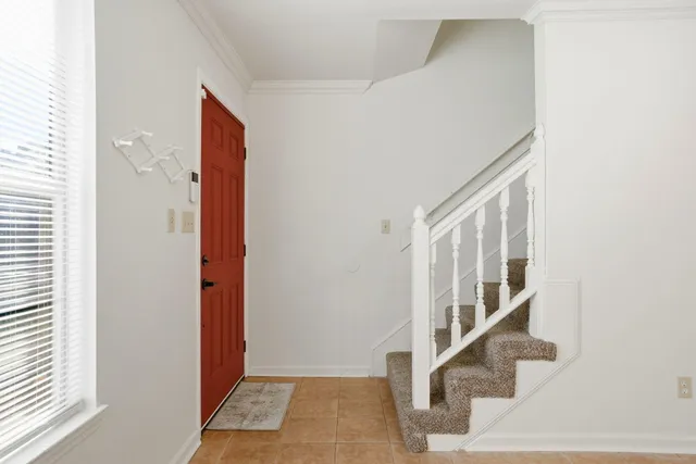 a view of an empty room with a fireplace