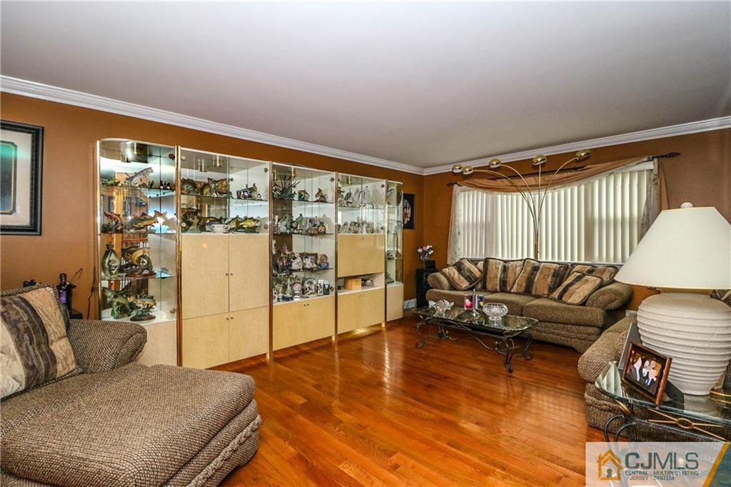 7307 Hana Road Edison, NJ 08817 - Photo 2 of 24 a living room with furniture and a floor to ceiling window