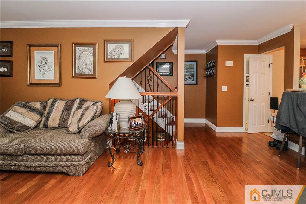 7307 Hana Road Edison, NJ 08817 - Photo 3 of 24 a living room with furniture and a wooden floor
