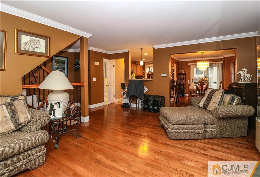 7307 Hana Road Edison, NJ 08817 - Photo 4 of 24 a living room with furniture and a wooden floor