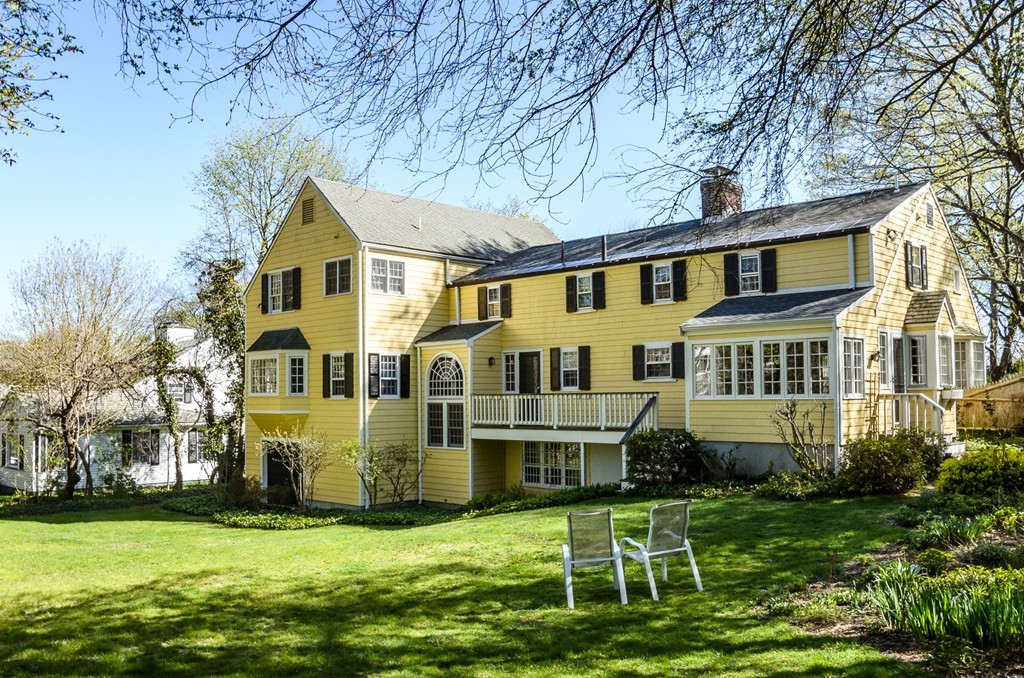 68 Old Farm Road Newton, MA 02459 - Photo 22 of 23 a front view of a house with a yard table and chairs
