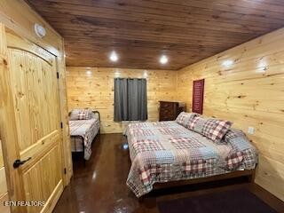 138 Mathews Road Oneida, TN 37841 - Photo 13 of 31 a bedroom with a bed and wooden floor