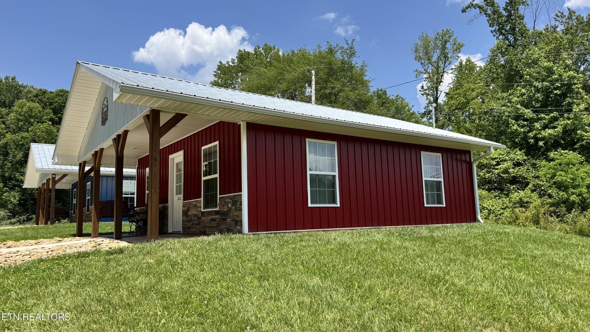 138 Mathews Road Oneida, TN 37841 - Photo 26 of 31 a front view of a house with a garden