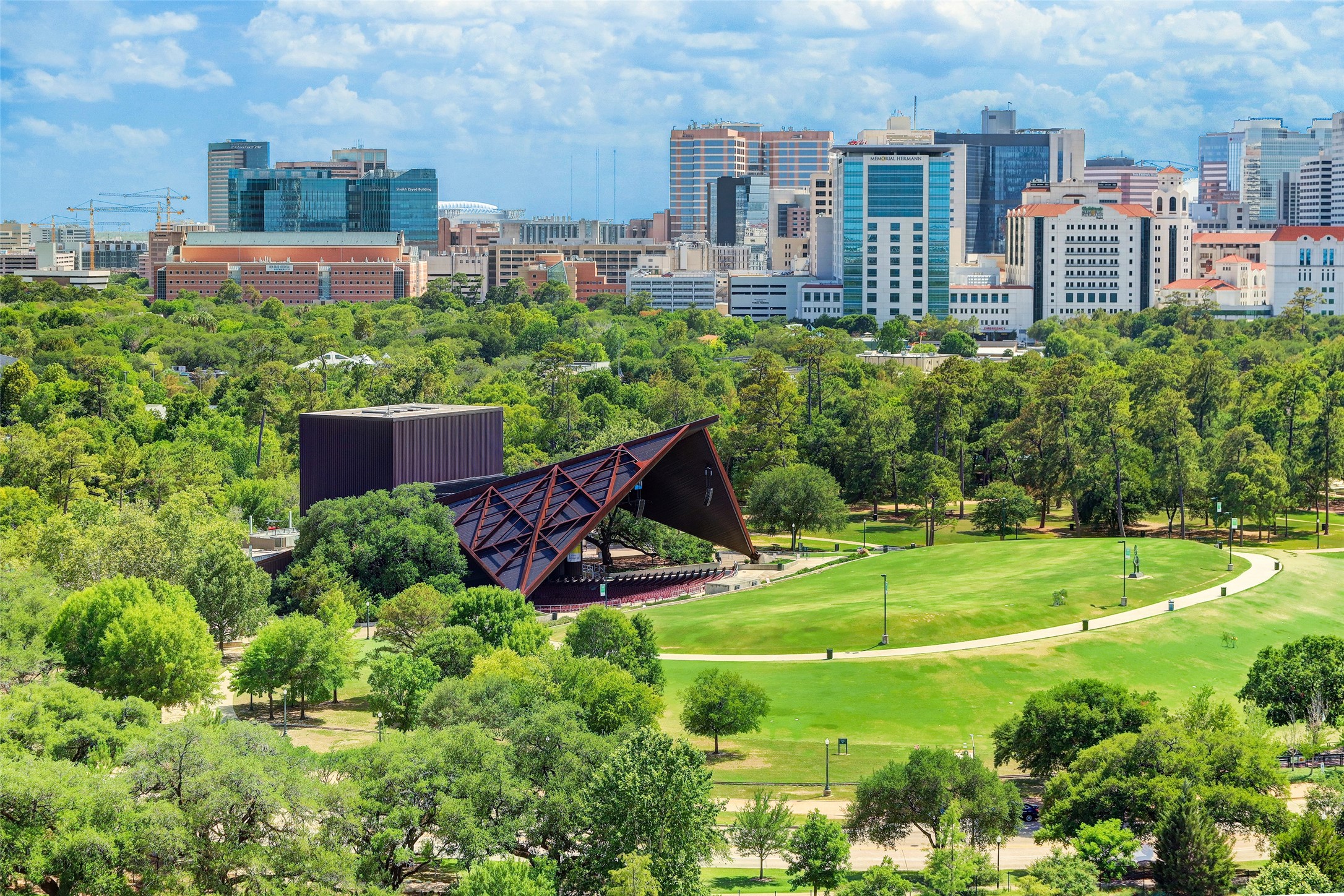 5218 Crawford Street Houston, TX 77004 - Photo 17 of 22 This view of Hermann Park includes Miller Outdoor Theatre. The Medical Center is seen in the background. Vist the zoo, reflection pool, golf course. walking/running trails, picnic areas, etc. Take the kids for a train ride around the park ---