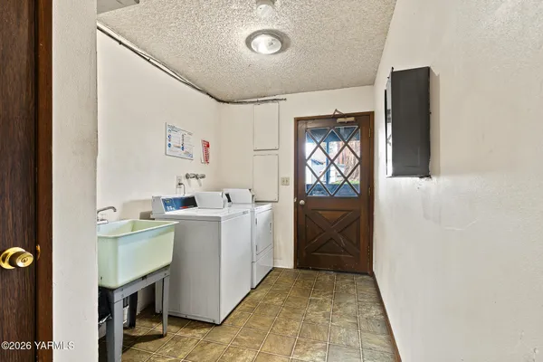 a utility room with dryer and washer
