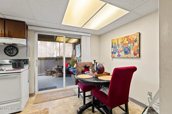a view of a dining room with furniture window and outside view