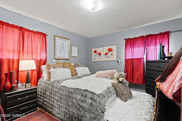 a bedroom with a bed and a closet