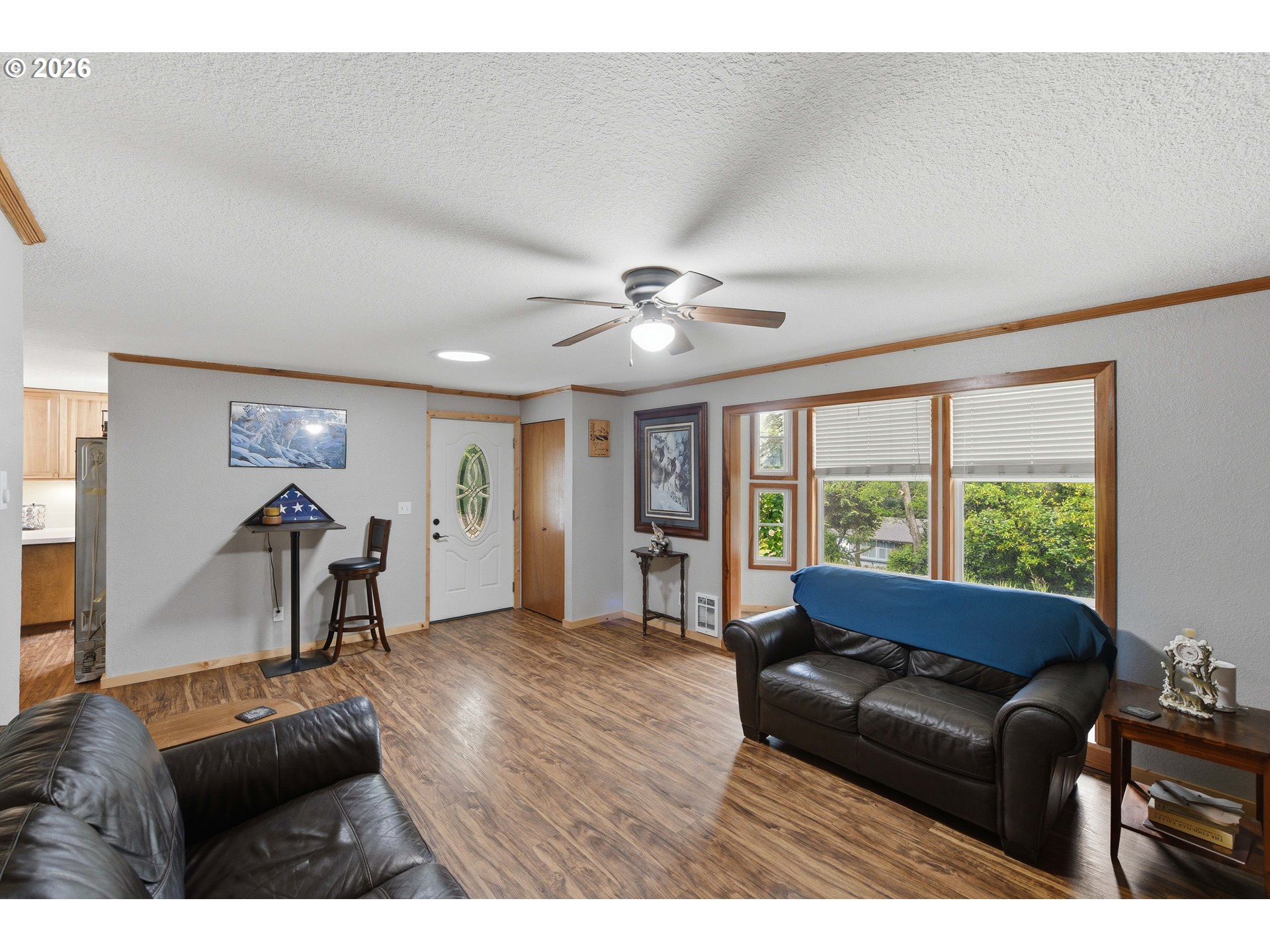 192 North Wood Ridge Road Coquille, OR 97423 - Photo 7 of 42 a living room with furniture and a large window