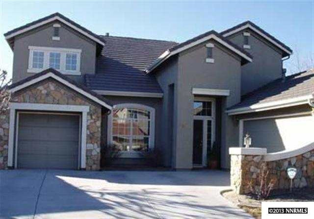 10685 Silver Cliff Way Reno, NV 89521 - Photo 1 of 1 a front view of a house with a garage