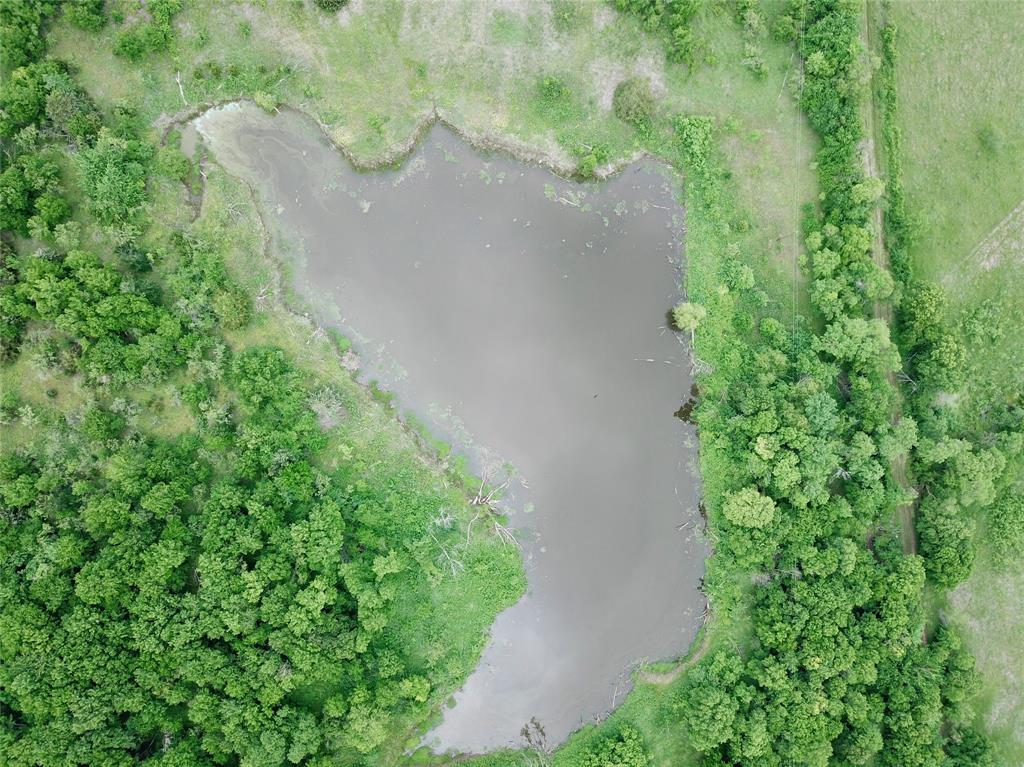 1 Fm 85 Ennis, TX 75119 - Photo 13 of 39 an aerial view of a house with a yard and garden