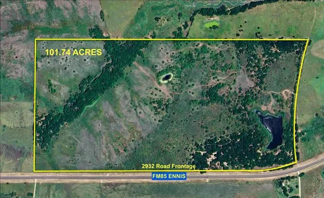 an aerial view of a yard with a street sign