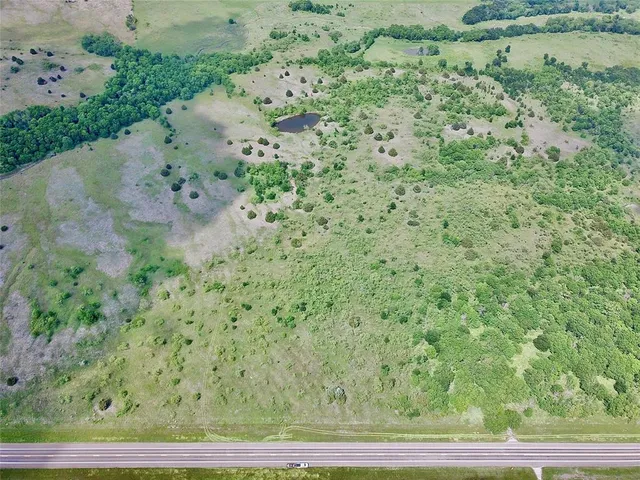 a view of a field with an outdoor space