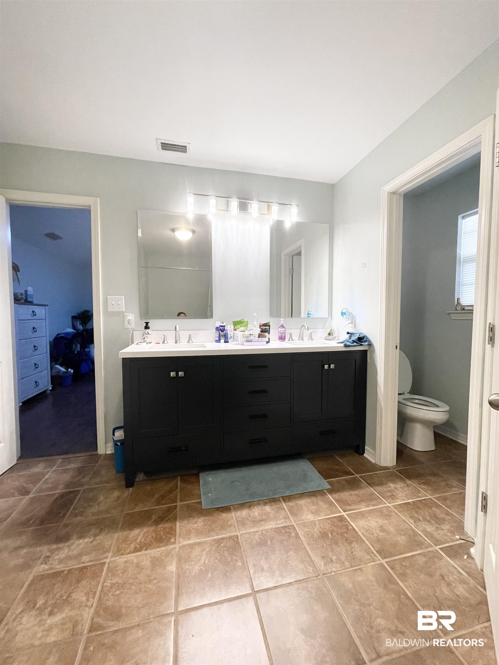 24590 Powell Road Loxley, AL 36551 - Photo 14 of 27 primary bath featuring double vanity, garden tub, walk in shower & walk in closet.