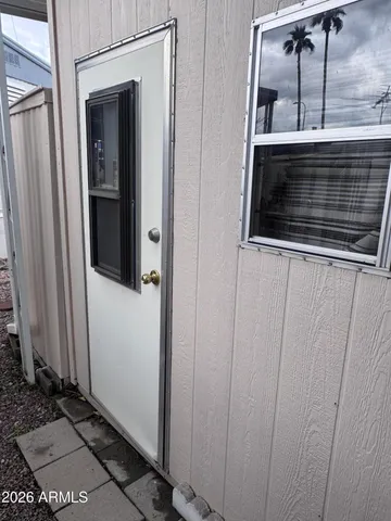 a kitchen with a refrigerator and cabinets