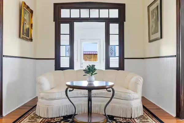 a dining room with furniture and window