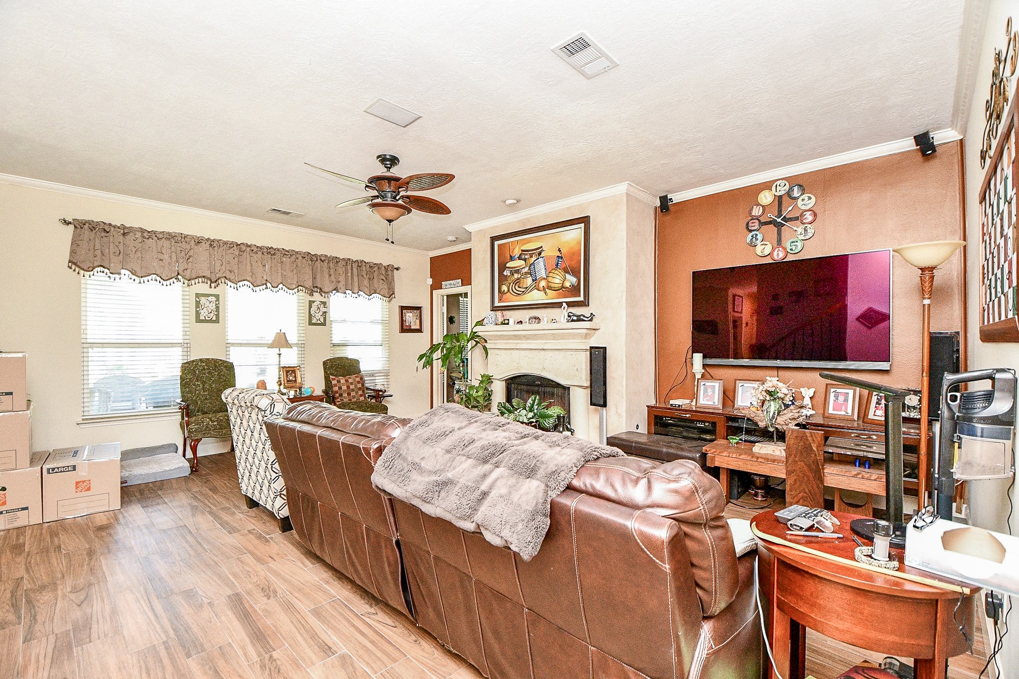 2910 Clayton Ridge Court Houston, TX 77082 - Photo 14 of 32 a living room with fireplace furniture and a flat screen tv