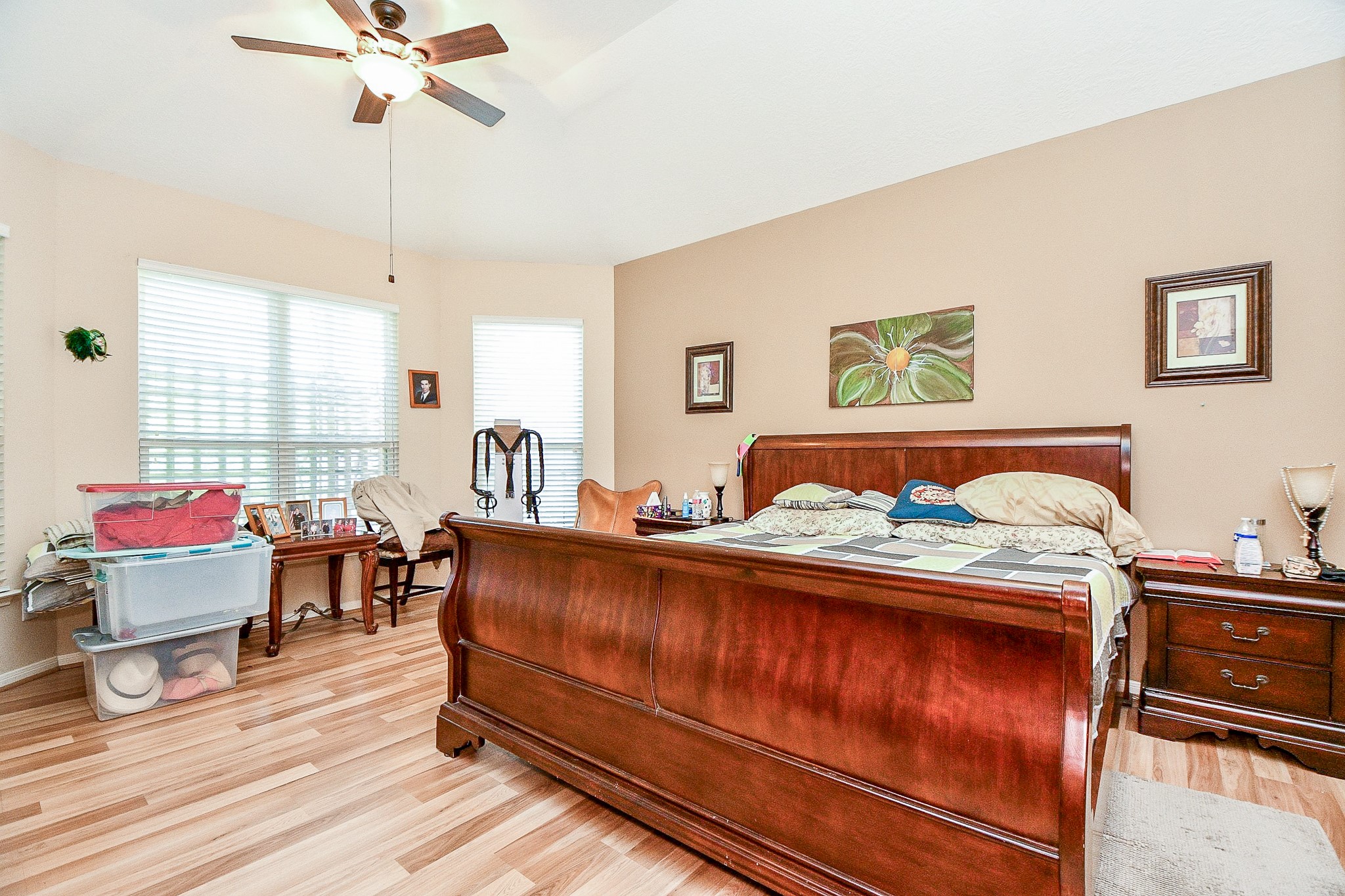 2910 Clayton Ridge Court Houston, TX 77082 - Photo 16 of 32 a bedroom with a bed and wooden floor