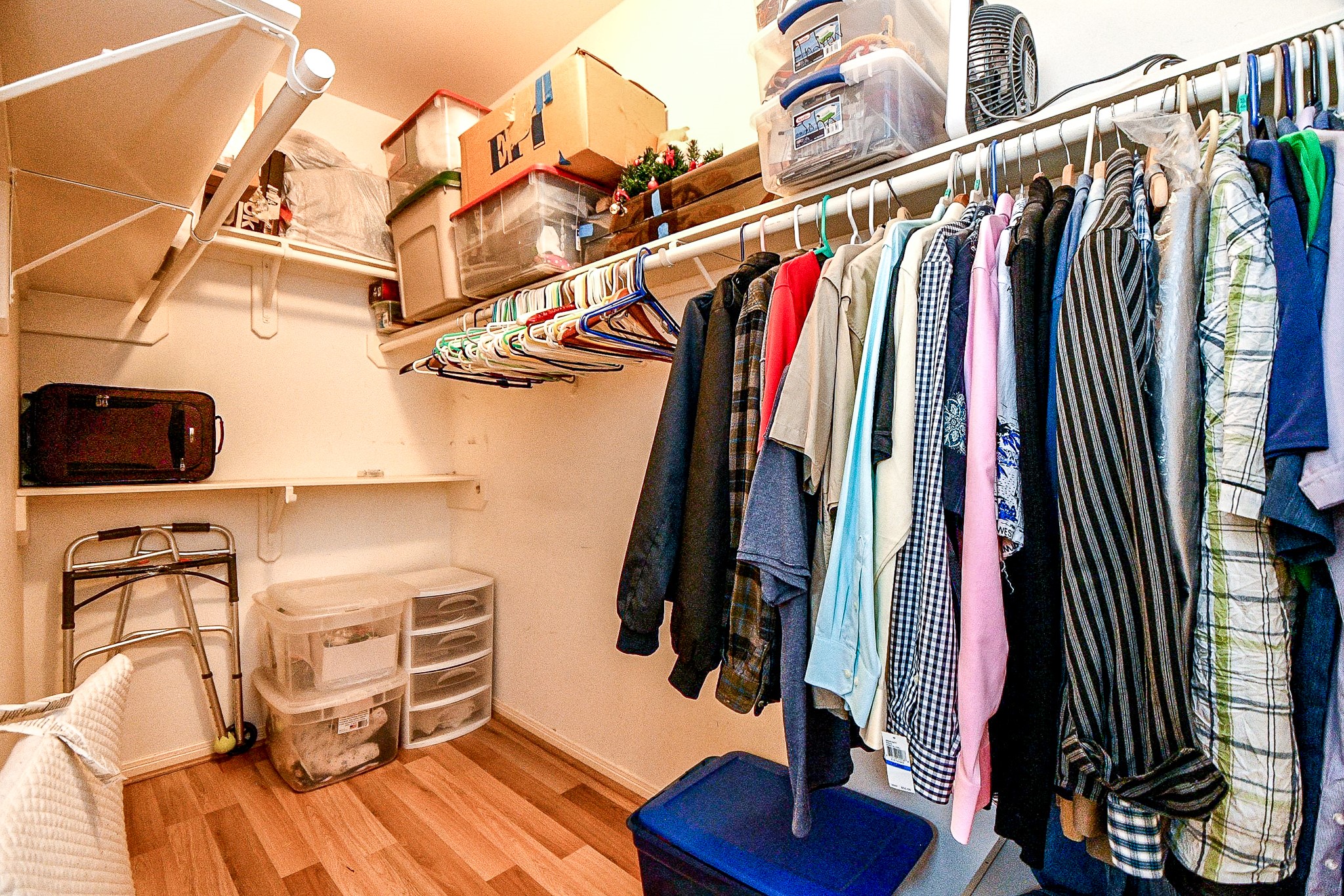 2910 Clayton Ridge Court Houston, TX 77082 - Photo 19 of 32 a view of walk in closet with clothes and shoes