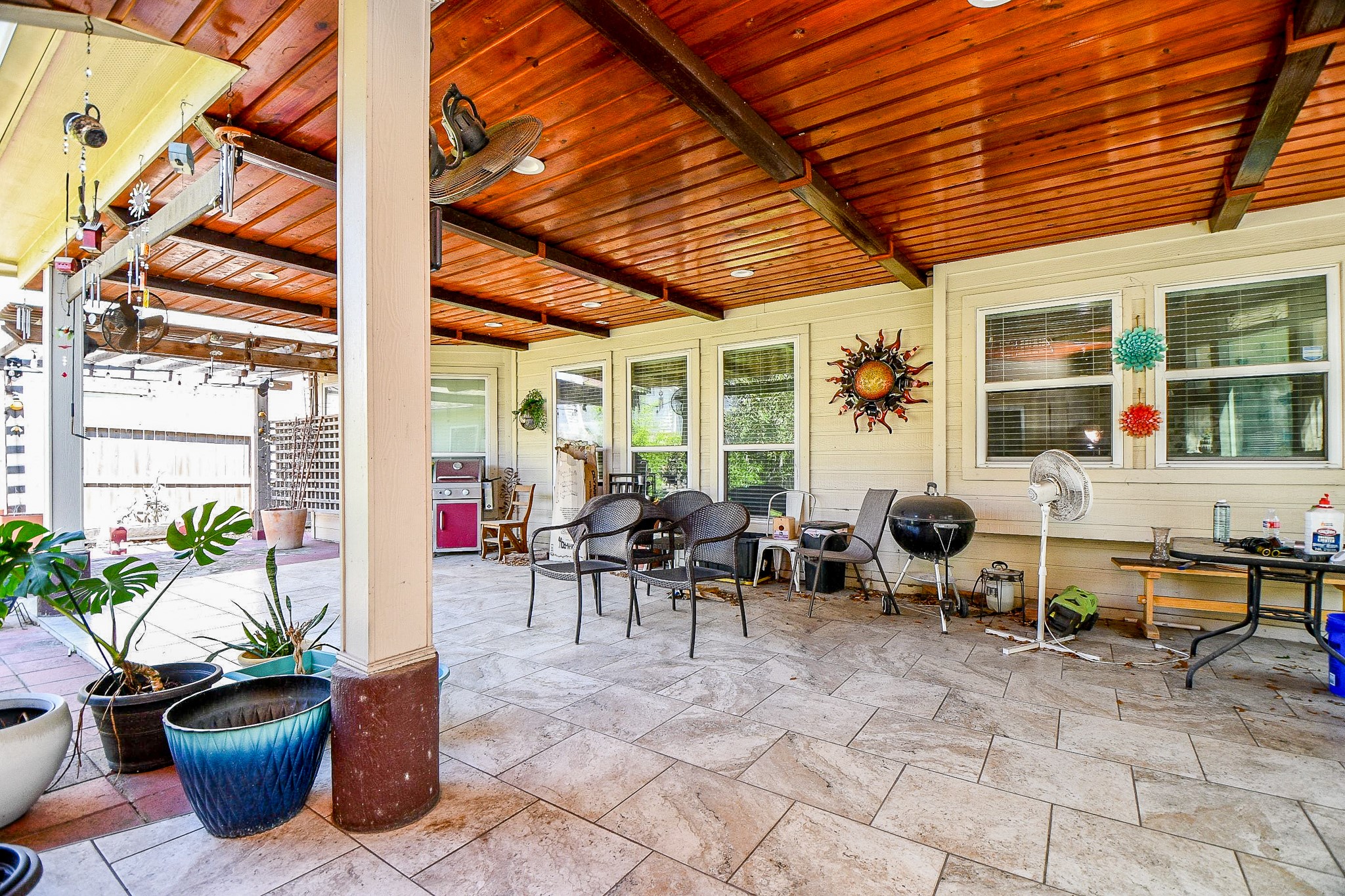 2910 Clayton Ridge Court Houston, TX 77082 - Photo 2 of 32 Covered and tiled backyard space! Great to enjoy during the summer.