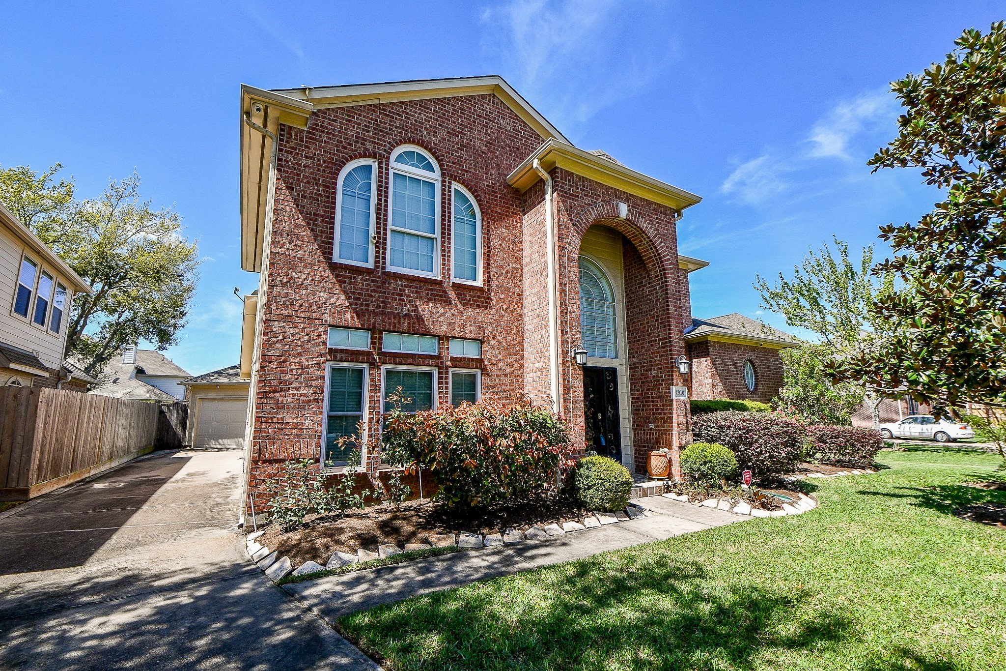 2910 Clayton Ridge Court Houston, TX 77082 - Photo 3 of 32 a front view of a house with garden