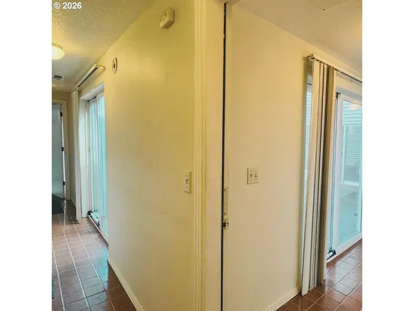 a view of a bathroom from a hallway