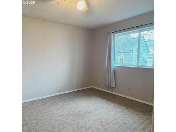 a view of a room that has a window in it