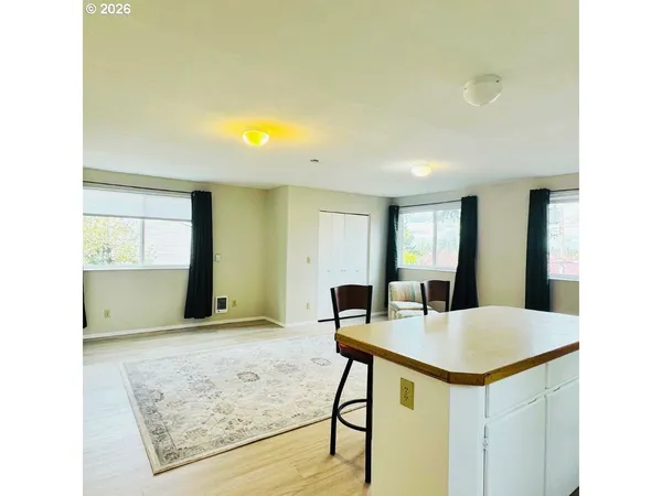 a view of kitchen with sink and window