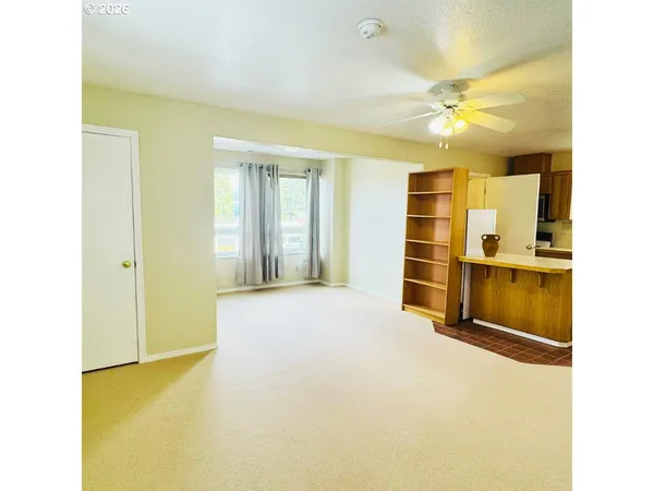 a view of an empty room with a window