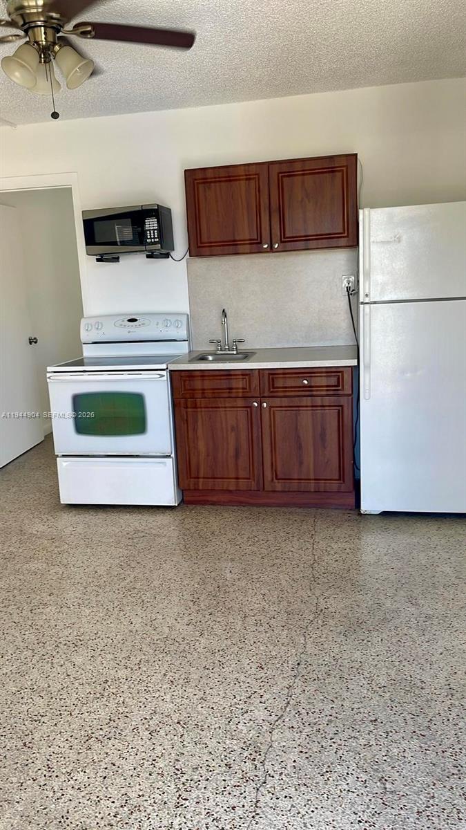 a bathroom with a sink and a microwave