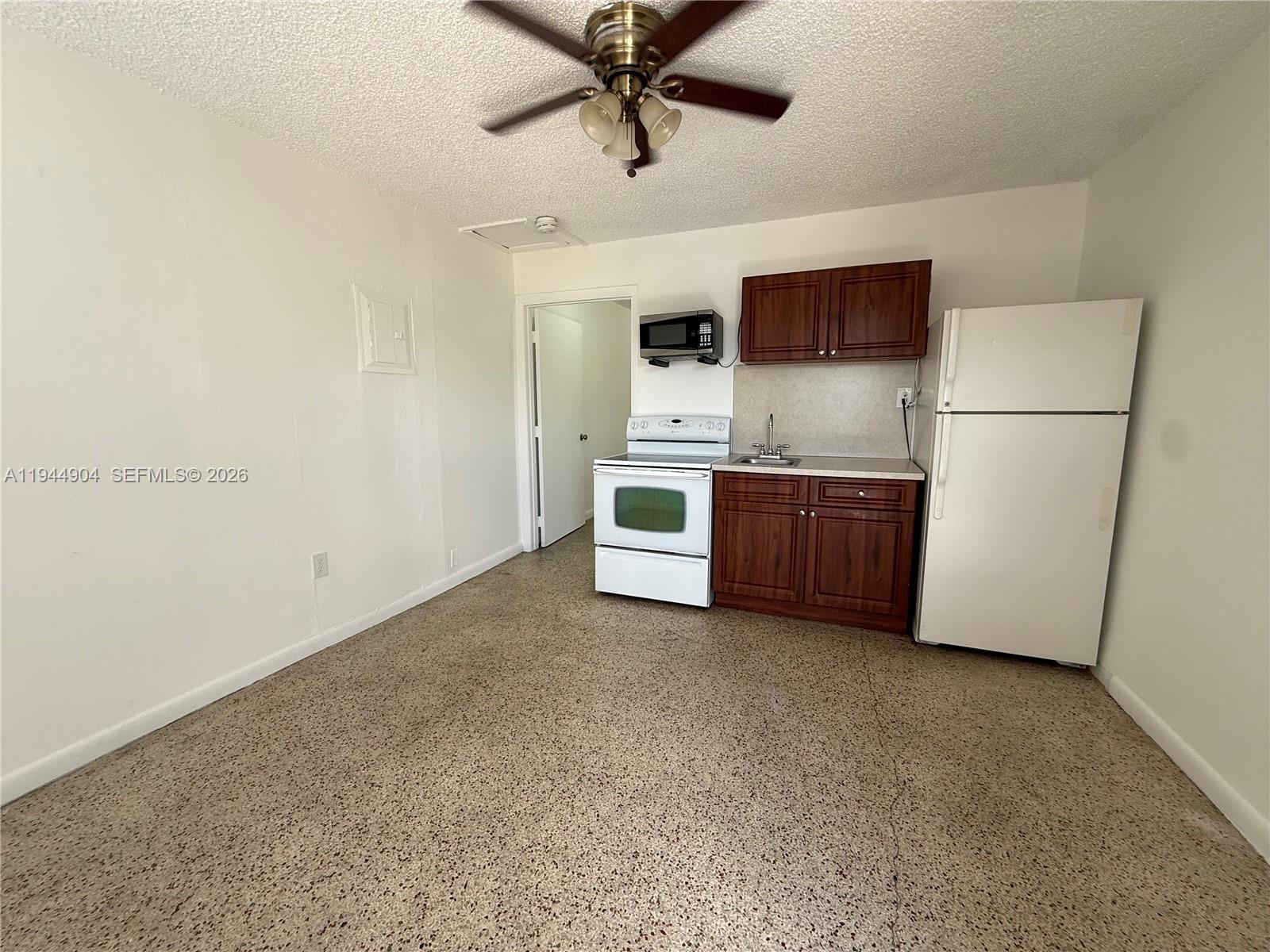 59 West 26th Street, Unit 6 Hialeah, FL 33010 - Photo 1 of 6 a kitchen with stainless steel appliances a refrigerator and a stove top oven