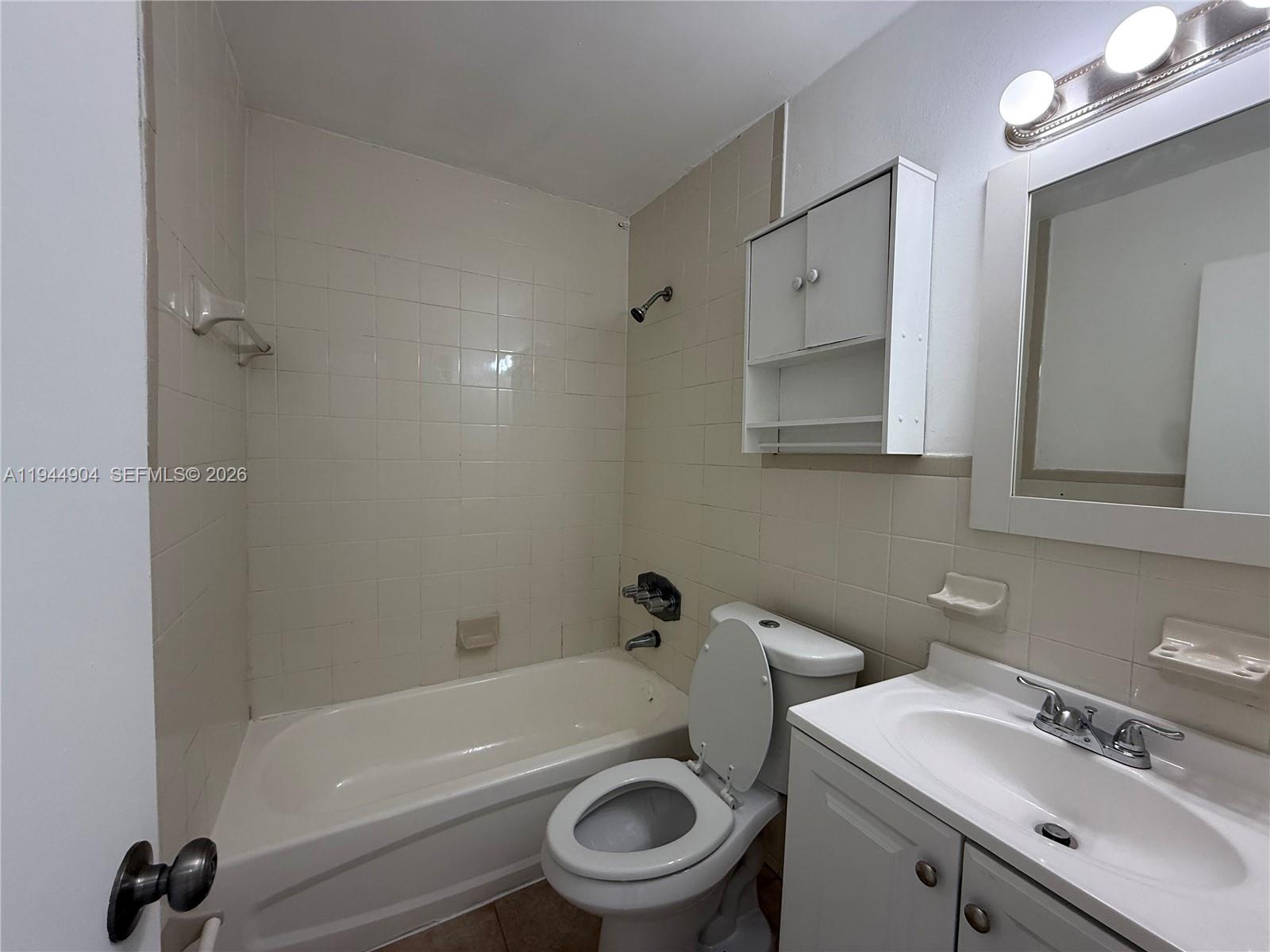 59 West 26th Street, Unit 6 Hialeah, FL 33010 - Photo 3 of 6 a bathroom with a sink toilet and a bathtub