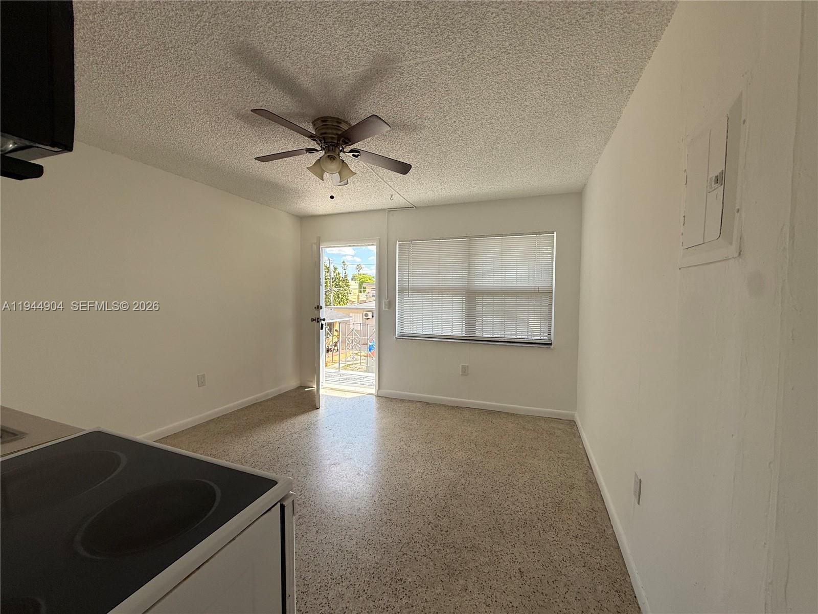 59 West 26th Street, Unit 6 Hialeah, FL 33010 - Photo 6 of 6 an empty room with windows