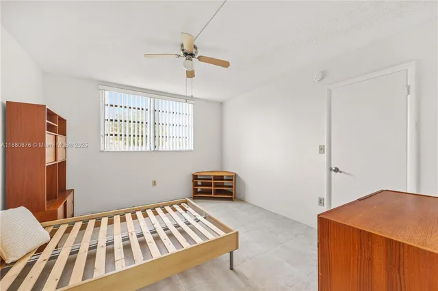 a en suite bathroom with a granite countertop sink