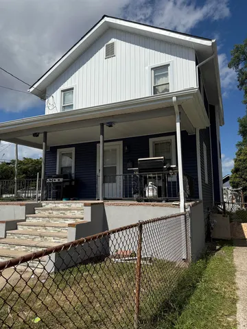 a front view of a house with garage