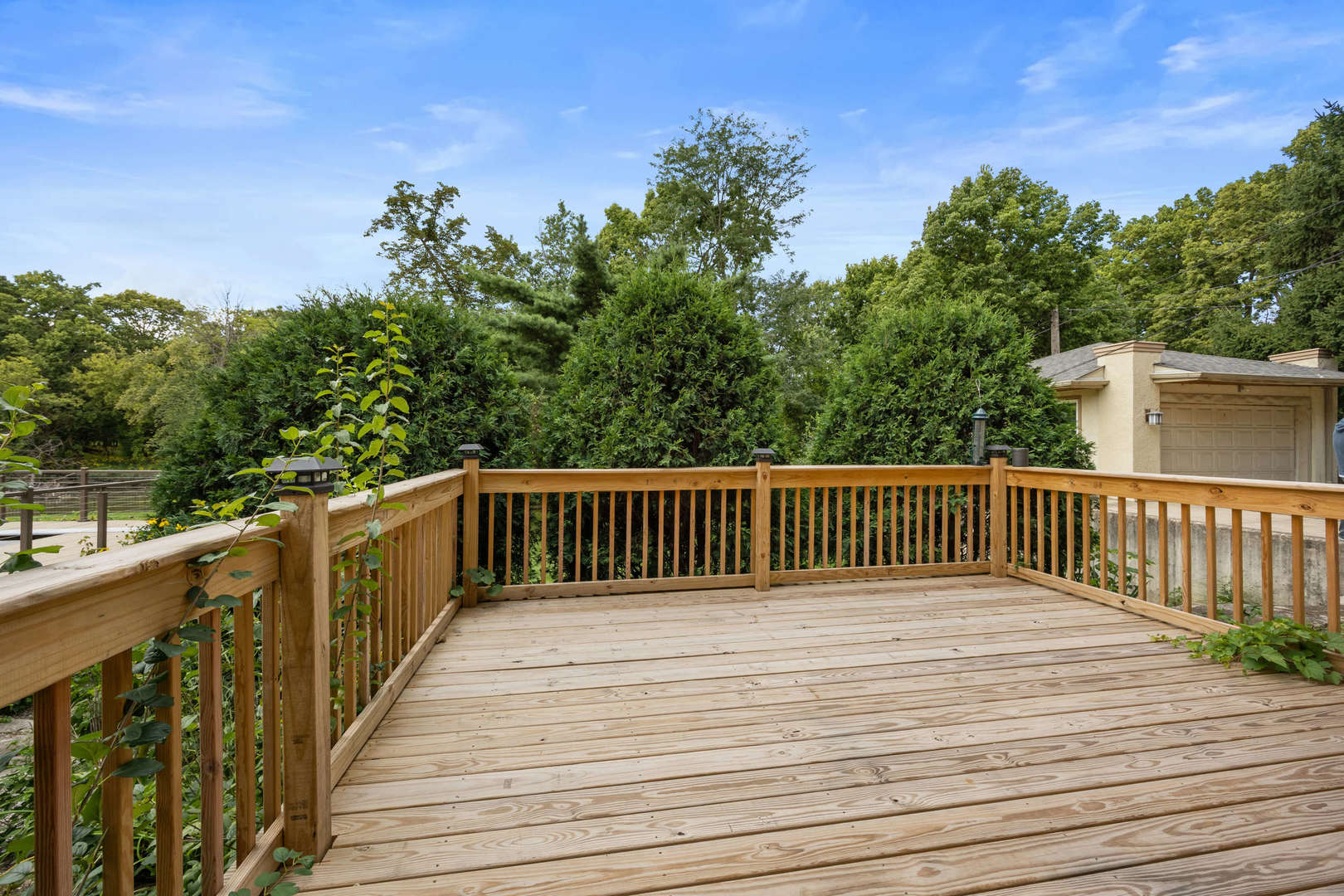 260 Maplewood Road Riverside, IL 60546 - Photo 12 of 48 a balcony with wooden floor in front of it